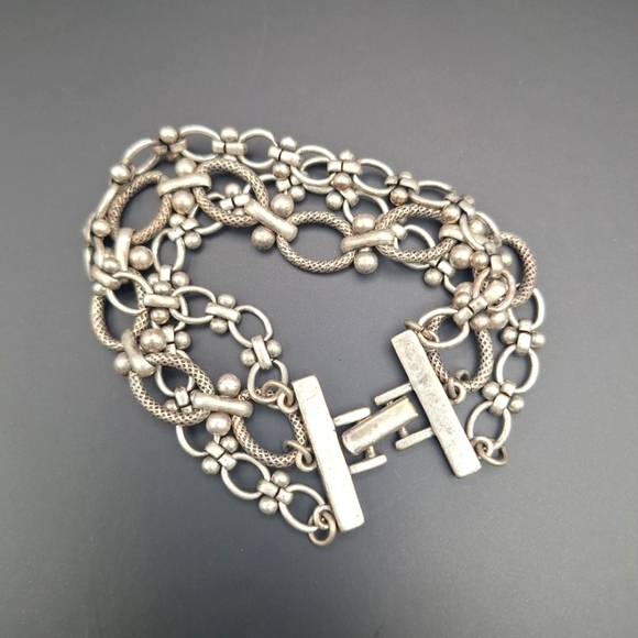 Jewelry - Three strand silver tone bracelet with fold-over clasp, 6.75"